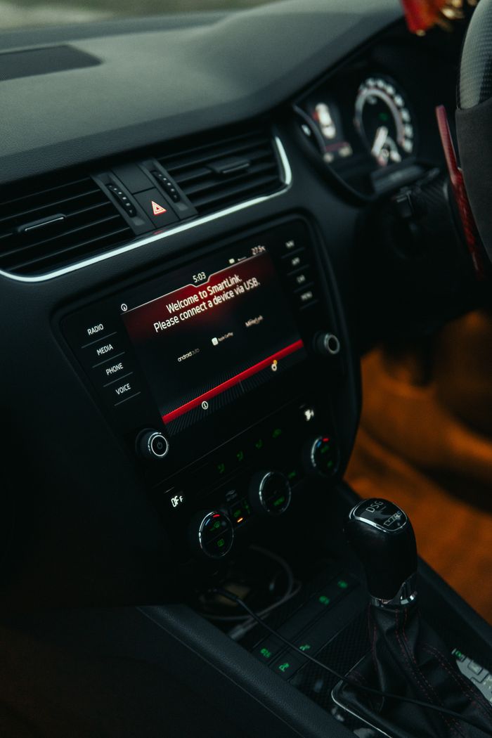 Close-up view of a modern car interior featuring a digital touchscreen display, showcasing advanced technology.